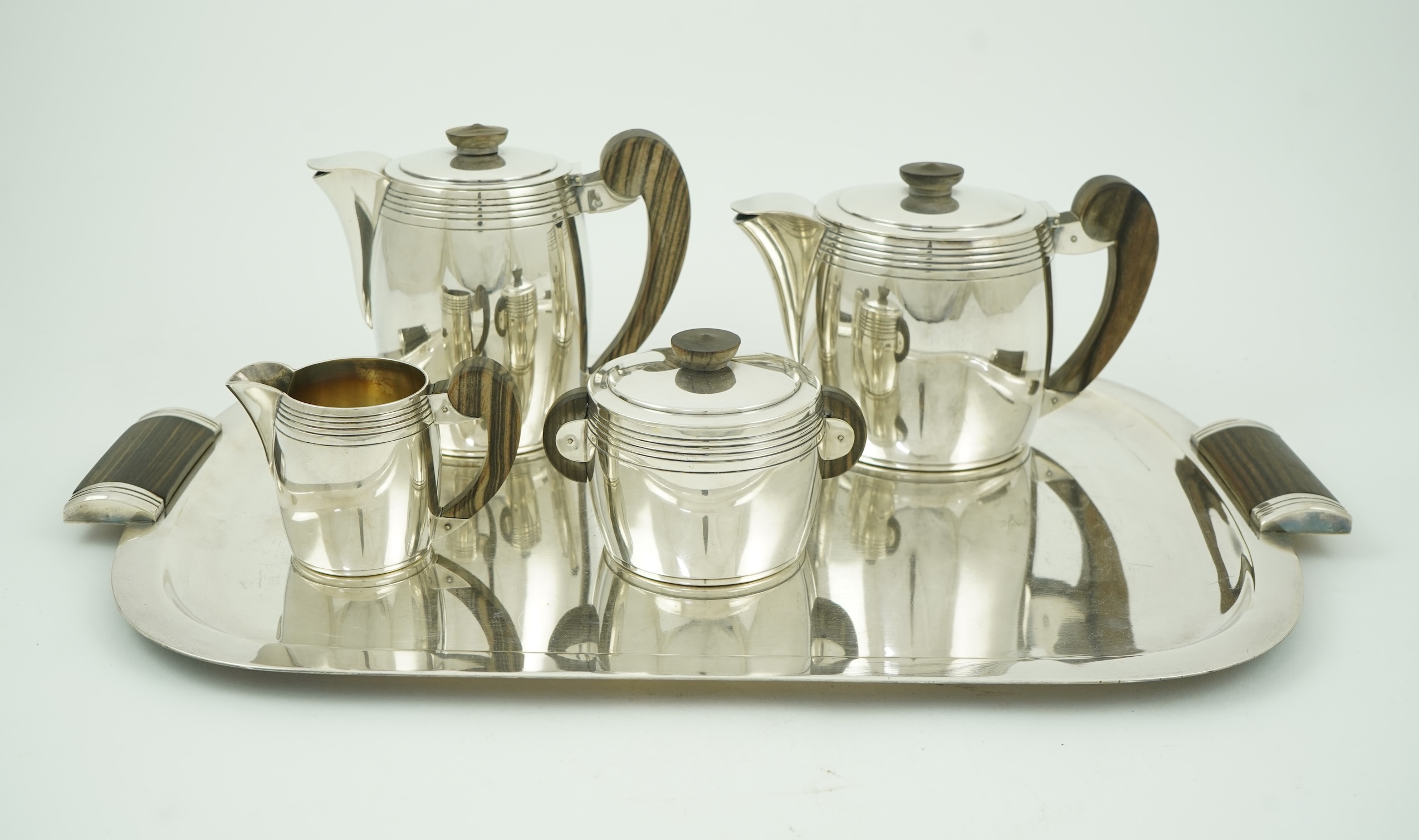An Ercuis Art Deco silver plated Macassar handled four piece tea or coffee set